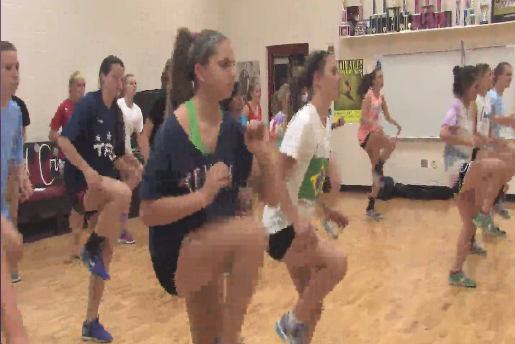 Soccer girls move their feet to the Zumba beat