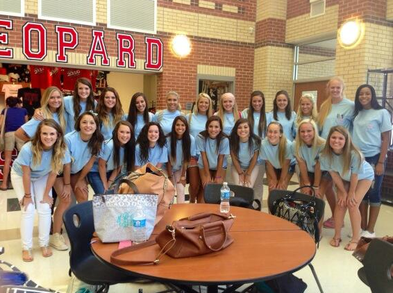 Some of the senior girls gather in the commons during the day to take a picture in their Class of 2014 senior shirts. 