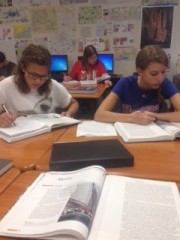 Taking the first AP class available to freshmen, students, Kennedy Miller. Katie Williams, and Zoe Kahana, spend class time taking notes from the textbook.  With finals just a few weeks away, some students are already preparing.