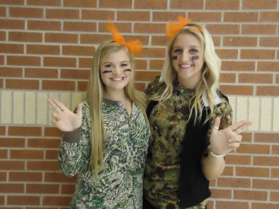 Seniors Molly Lacey and Katelyn Mackenzie are dressed in camouflage to support tonights game.