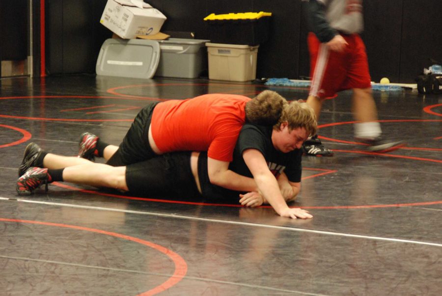 Varsity wrestlers Morgan Dooley and Thomas Elvin practice for the upcoming meet.
