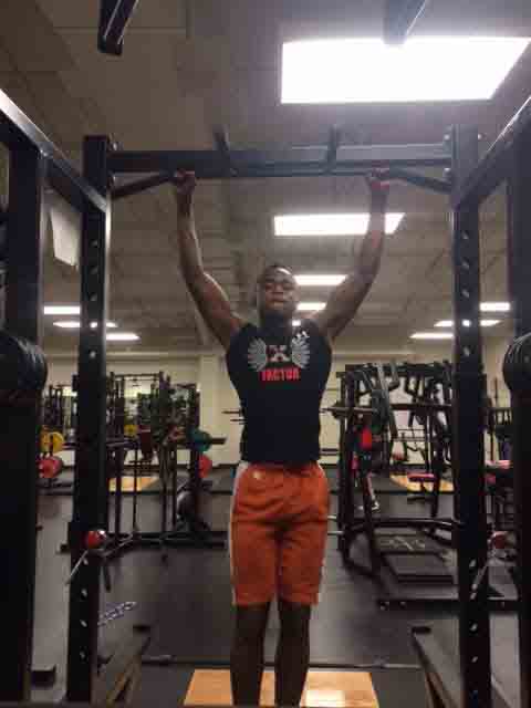 Sophmore Kitrell Phillips performing the innovative sport of powerlifitng in the weight room.   