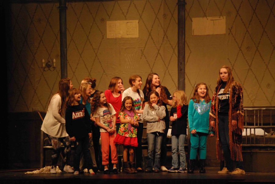 Elementary+school+girls+and+older+are+participating+as+cast+in+Annie.