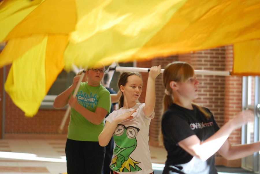 Due to a lack of space in the indoor facility, the gyms, and on the field, the color guard team has been holding practices in the lobby of the auditorium.