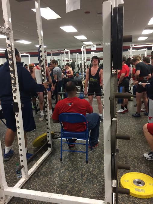 Junior Sam Wortham lifts at a powerlifting meet
