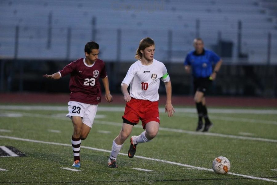 Senior Cody McLemore competes against a Wylie defender. 