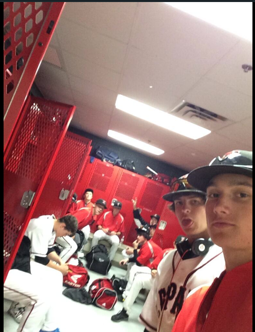Junior John Weichel and the baseball team prepare for a game in their locker room. 