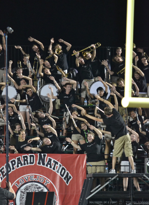 Senior Michael Pezzuli leads the band in their roller coaster game as one of three drum majors of the band.