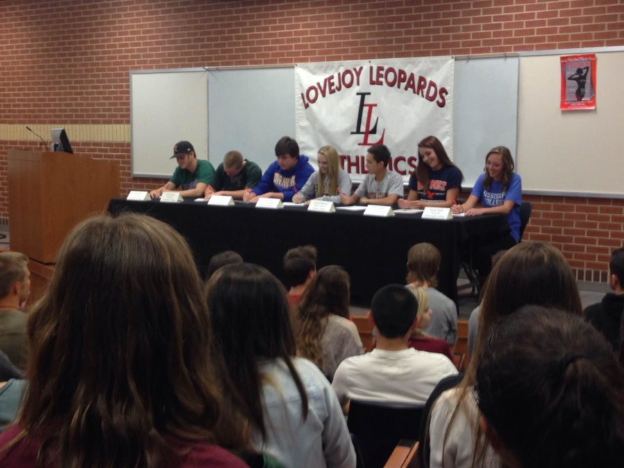 The seven seniors signed to play college athletics on Wednesday, April 16, 2014.