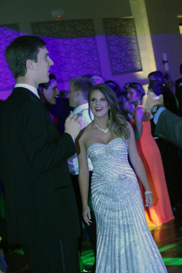 Smiling in between one of the songs, Kevin Inman and Lauren Gilcrease wait to dance on the dance floor. 