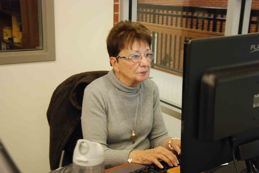 Jane Schiller, often confused as a librarian, is actually a volunteer that helps out in the library. 