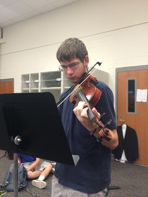 Junior Ryan Thompson spent first period perfecting his pieces for tonights orchestra concert. 