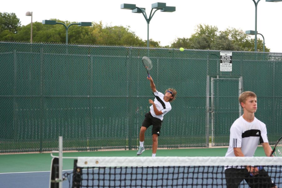 Junior Grady Wells and freshman Jack Bennett play doubles together against Flower Mound. 