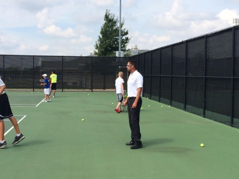 Tennis Coach Adam Cherry has led the team in one of their most successful seasons in history. 