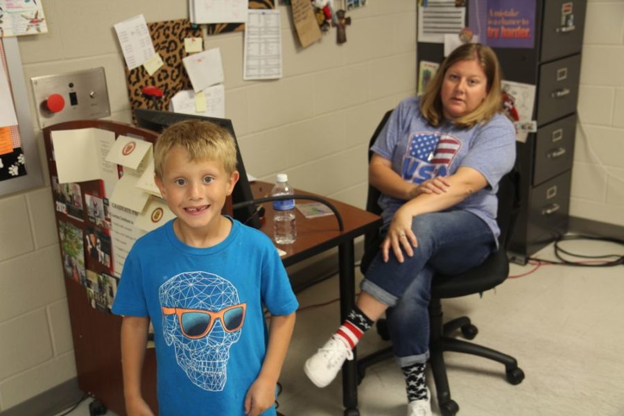 Many elementary students, such as science teacher Theresa Dollingers son, ride a bus to the high school in eighth period to be with their teacher parents.