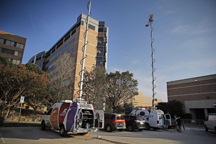 Media crews stage across from the emergency room entrance to Texas Health Presbyterian Tuesday, September 30, 2014, in Dallas. A patient at the hospital tested positive for the Ebola virus.