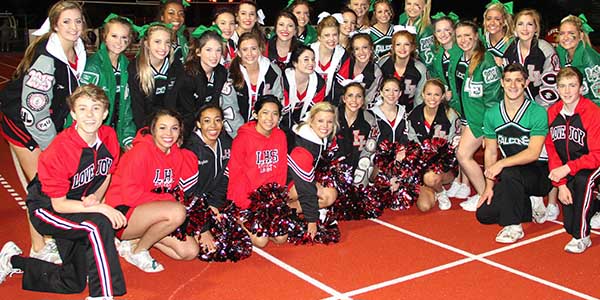During each game it is a traditional for cheerleaders to cheer with the opposing team. After spending time with the Lake Dallas cheerleaders, the two squads pose for a picture.