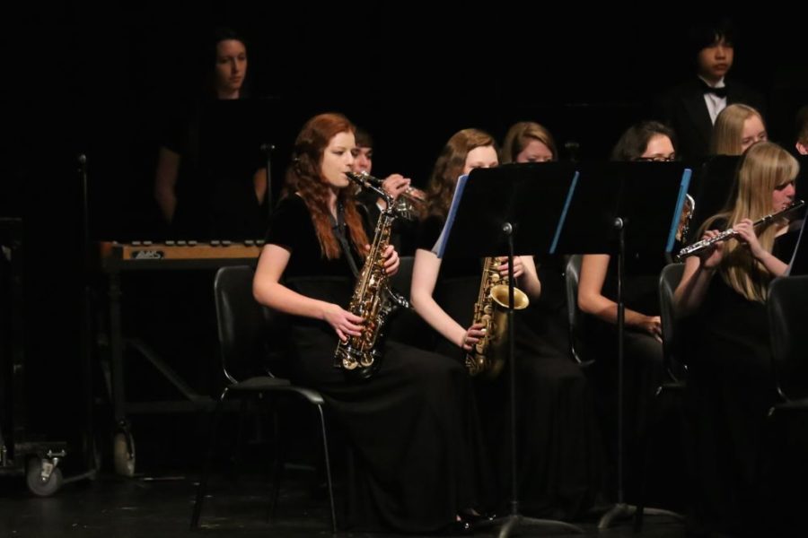 Sophomore Sarah Broughton plays the saxophone with the wind symphony.