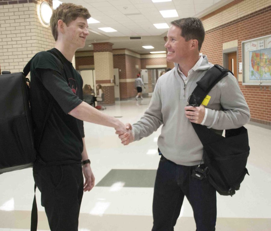 Garron Weeks shakes hands with reporter Ted Madden after his interview.