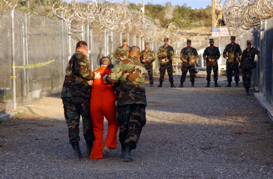 Taliban+and+al-Qaida+detainees+in+orange+jumpsuits+sit+in+a+holding+area+during+in-processing+to+the+temporary+detention+facility+on+Jan.+18%2C+2002%2C+in+Guantanamo+Bay%2C+Cuba.+The+Senate+Select+Committee+on+Intelligence+released+a+report+on+the+CIAs+interrogation+practices.+The+report+said+the+CIA+misled+Americans+and+government+policymakers+about+the+effectiveness+of+the+program+that+was+secretly+put+into+place+after+the+9%2F11+terror+attacks.