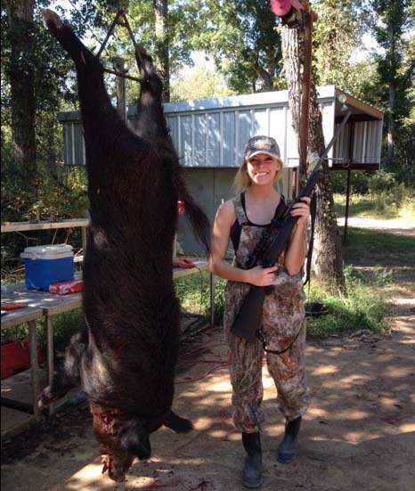 Collin County is hosting a meeting Thursday to discuss the issue of feral hogs in the area. As part of this, the hunting of feral hogs will be discussed, something sophomore Ellie Smith is well versed with as she stands next to a hog she took down.
