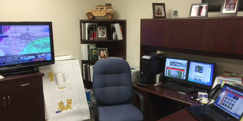 With a flat-screen TV, two computer monitors, and a laptop screen all displaying different weather forecasts for the area; assistant superintendent Dennis Womack takes many steps when deciding if school will be closed due to inclement weather.