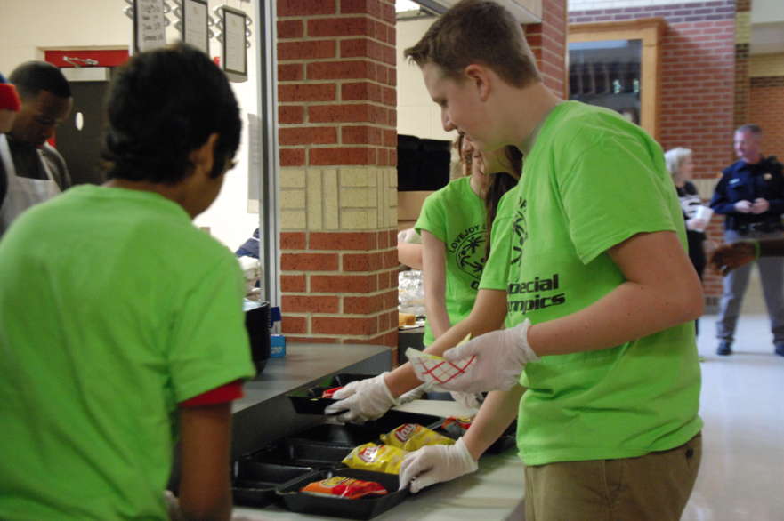 Willow Springs PALS students package meals for the athletes as the games come to a close.