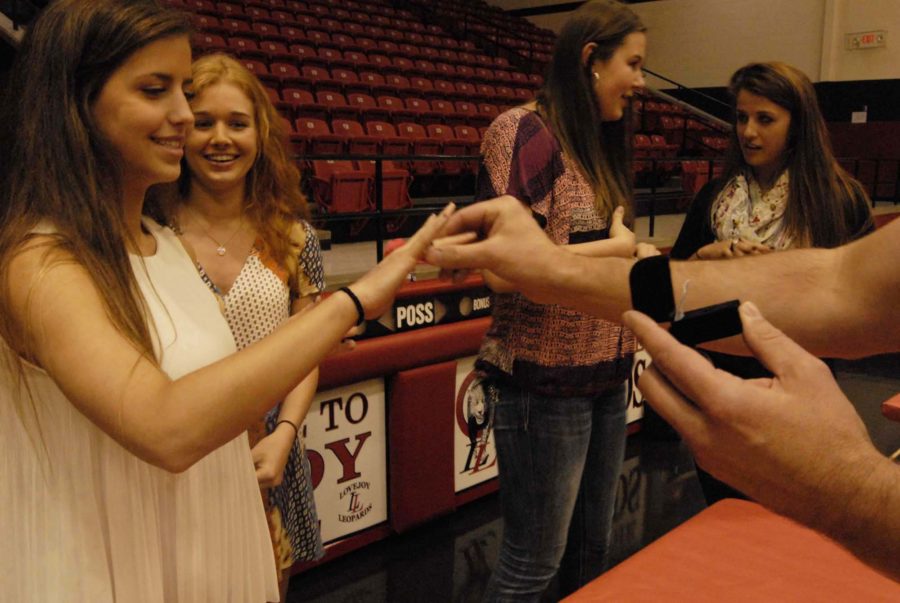 Junior Kinsey Ray receives her state ring after the teams 2014 state title win.