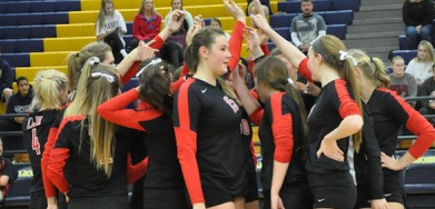 The 2014-2015 varsity volleyball team after winning their sixth state championship.