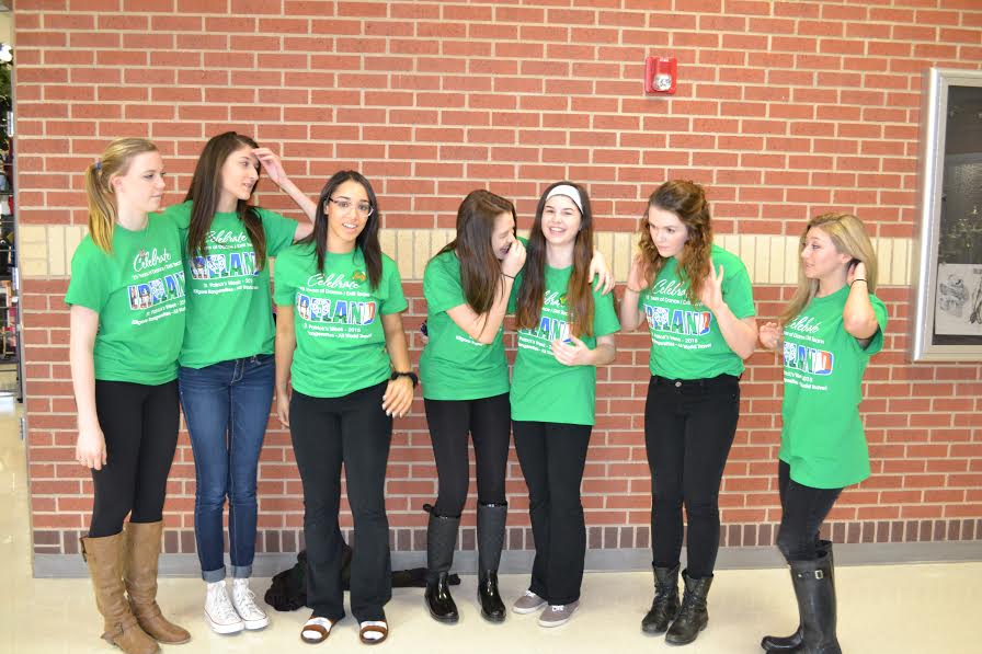 The Majestics pose together in shirts advertising their upcoming trip to Ireland during spring break.
