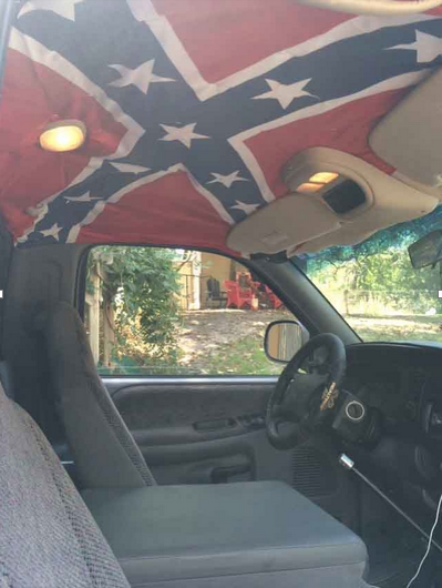 Attached to the interior roof of his truck, junior Josh Shewmake believes the confederate flag is about southern pride and owns several things featuring the Confederate flag.