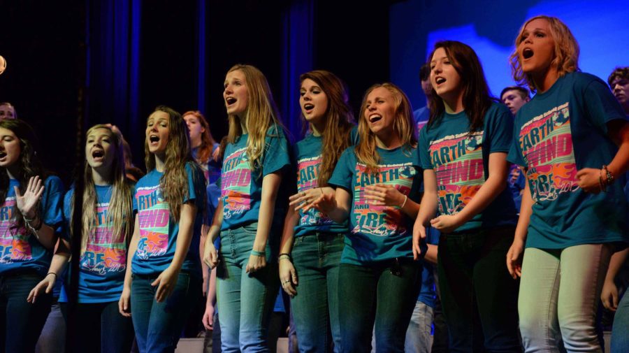 Senior choir girls display their talents at the front of the stage.
