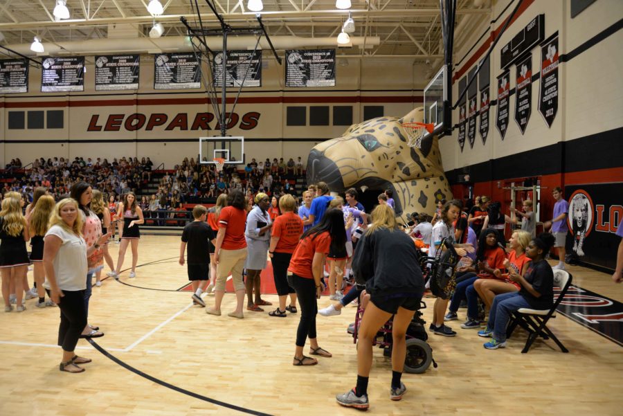 Before the Pep Rally started PALS and Special Olympic Athletes were seated on the East side of the gym. Students were packing in the seats for this pep rally.