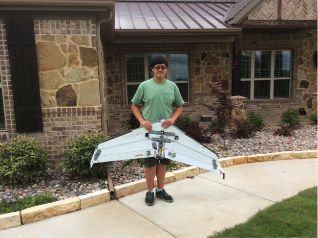Junior Joe Kwok with one of his airplanes. 