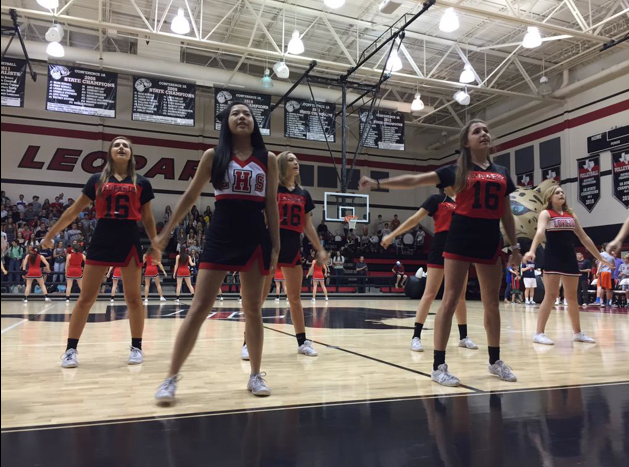 The cheerleaders lead cheers, like A-O and the Leopard Rumble, to increase spirit.