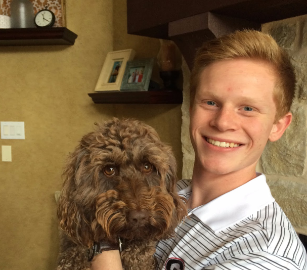 After growing up together, students leaving for college are forced to leave their best friends, their dogs behind. Above is senior Matt Smith with his furry pal.