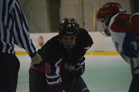 Center, Michael Kline, focused on the puck at a game against Marcus High School.
