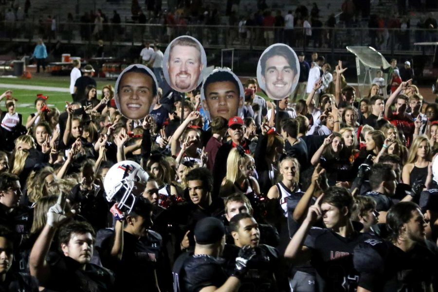 In order to boost spirits during football games, student section members have created fatheads of players and coach Cox. 