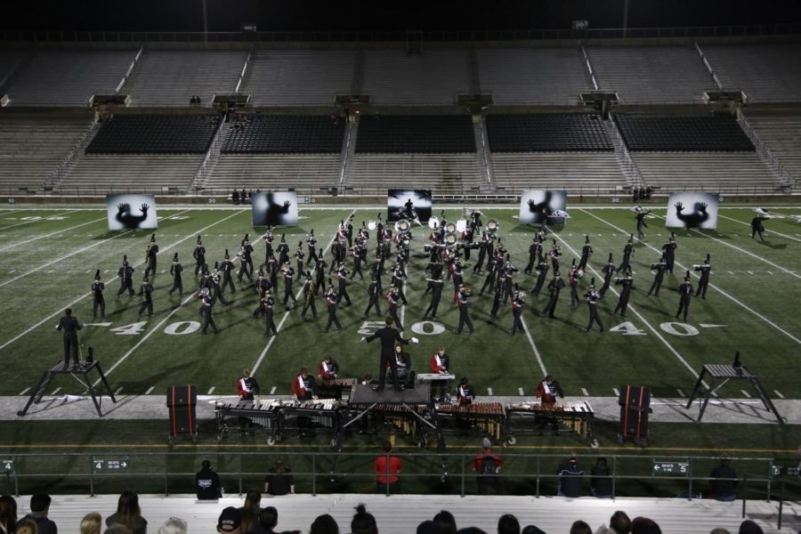 The+woodwinds+and+brass+form+interlocking+blocks+that+slide+alongside+each+other+at+the+UIL+area+competition+in+Mesquite.