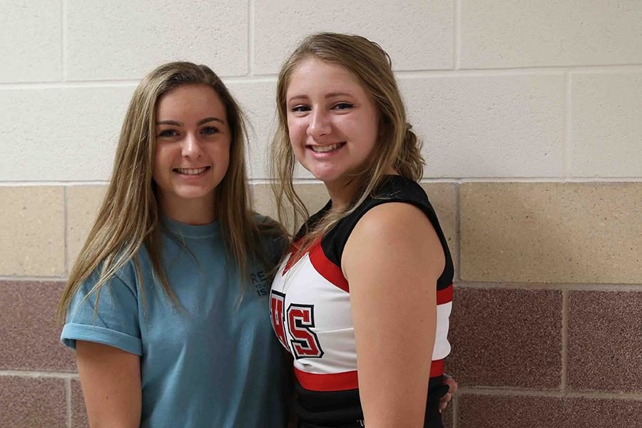 Sophomore Sophie Whitehead [left] came to the rescue of the varsity cheer squad last Friday during the homecoming pep rally junior Christine Schmidt injured her foot before the squads performance.
