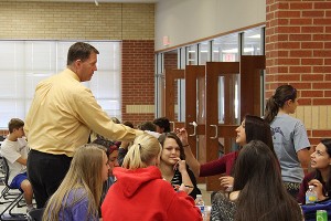 Junior Kioko Jahn samples a piece of sushi during C lunch from director of nutrition Mat McCarty.