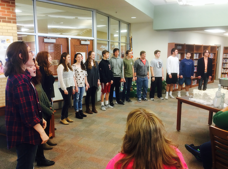 Choir spreads holiday cheer during exams – The Red Ledger