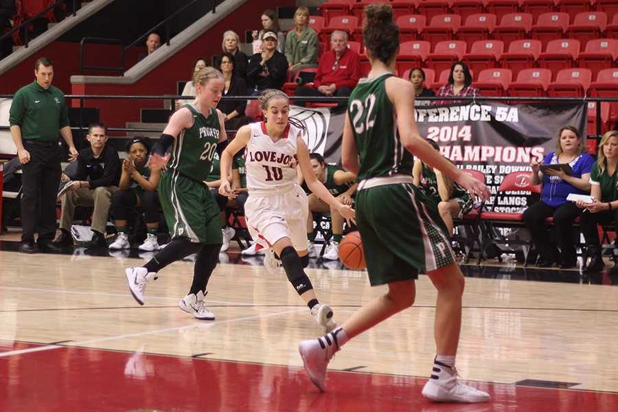 Kaylee Rekieta dribbles the ball across the court in a game against the Prosper Eagles.