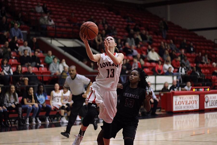 Taylor Meixelsperger takes shot against Sherman on Jan. 22. The girls basketball team is currently tied for the fourth in the district heading into the final regular season game.