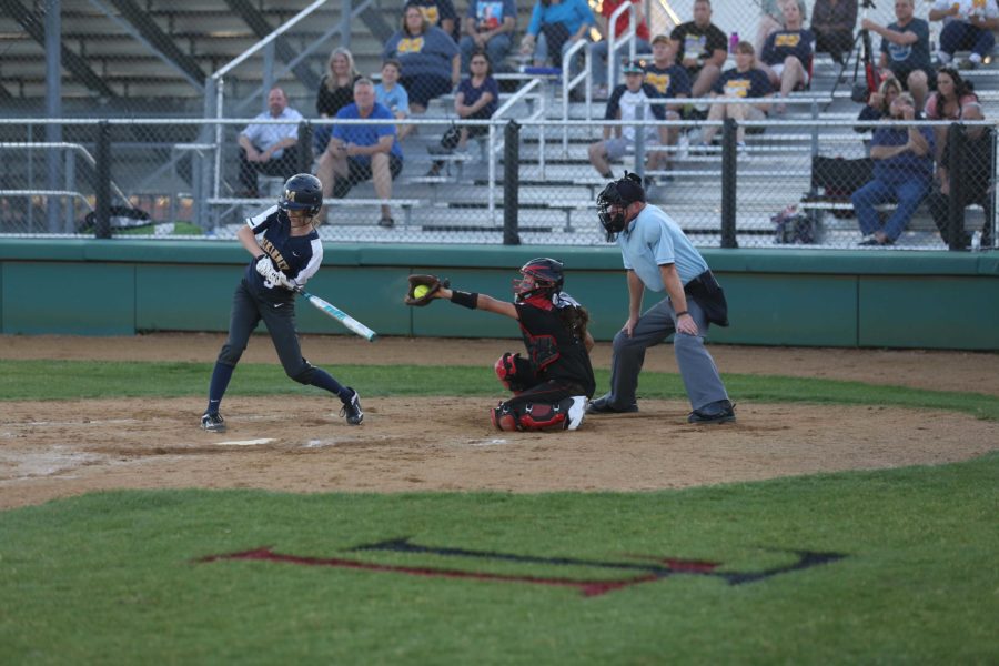 Celeste Soliz (5), behind the plate at last Fridays McKinney game, catches a strike. The softball team opens the playoffs tonight against The Colony.