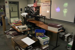 Animation teacher Ray Cooper is required to pack up and move his classroom due to expansions in E-hall and B-hall. 