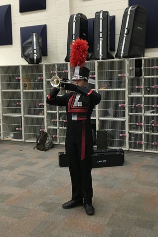 Nick Pitkin models the prototype for the new marching uniforms. 