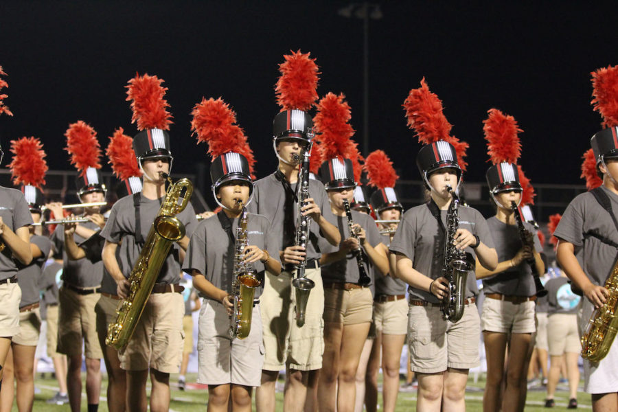 (Left to right) Leo Dobson, Jolina Tran, Mark Baron, Emily Orr perform The Ascent during the halftime show.