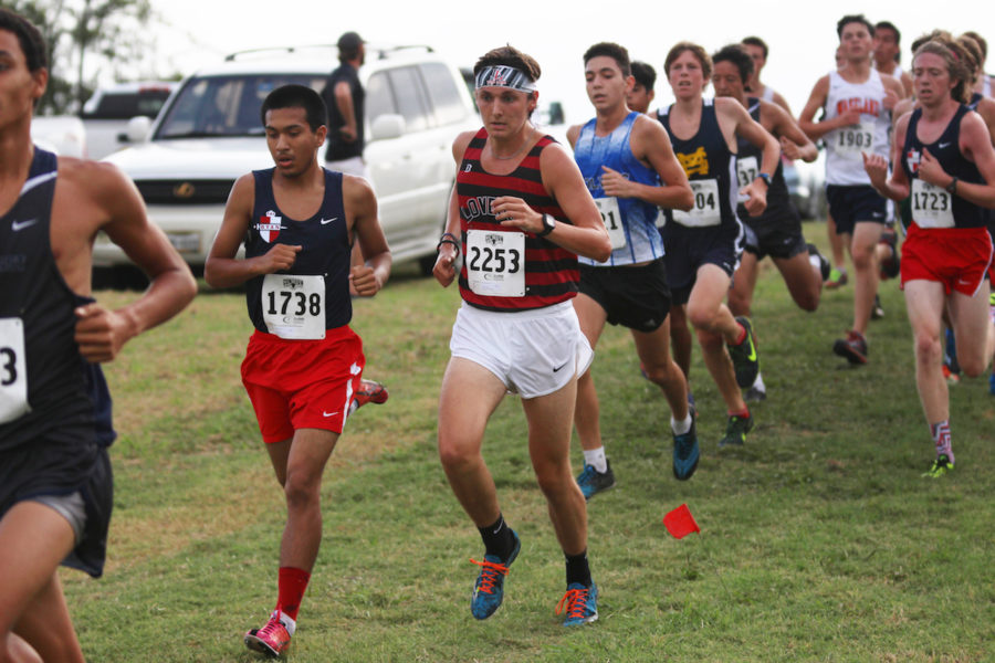 Junior Trevor Joiner keeps pace with the competition at the Lovejoy Fall Festival meet.