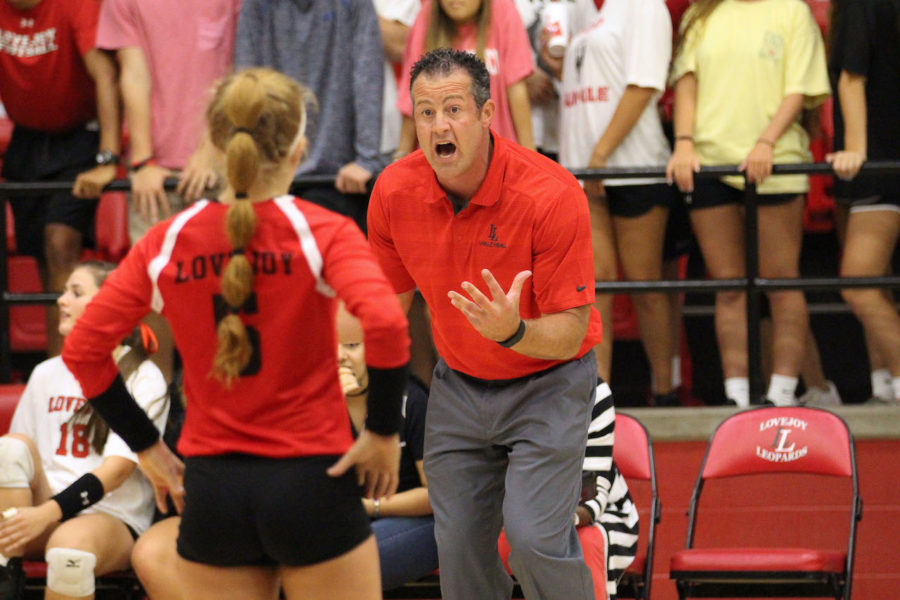 Head coach Jason Nicholson gives instructions to senior Lexie Smith during Tuesdays match. Volleyball will play Highland Park on Friday, projected to be the biggest district competition for the Leopards this season.